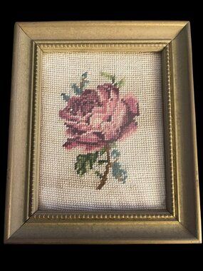 Vintage petit point rose embroidery in shades of pink and burgundy, green leaves